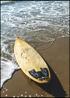 Yellow Surfboard on a Beach